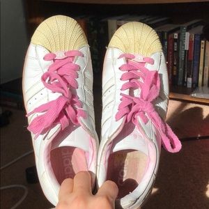 Pink Adidas Superstar shoes